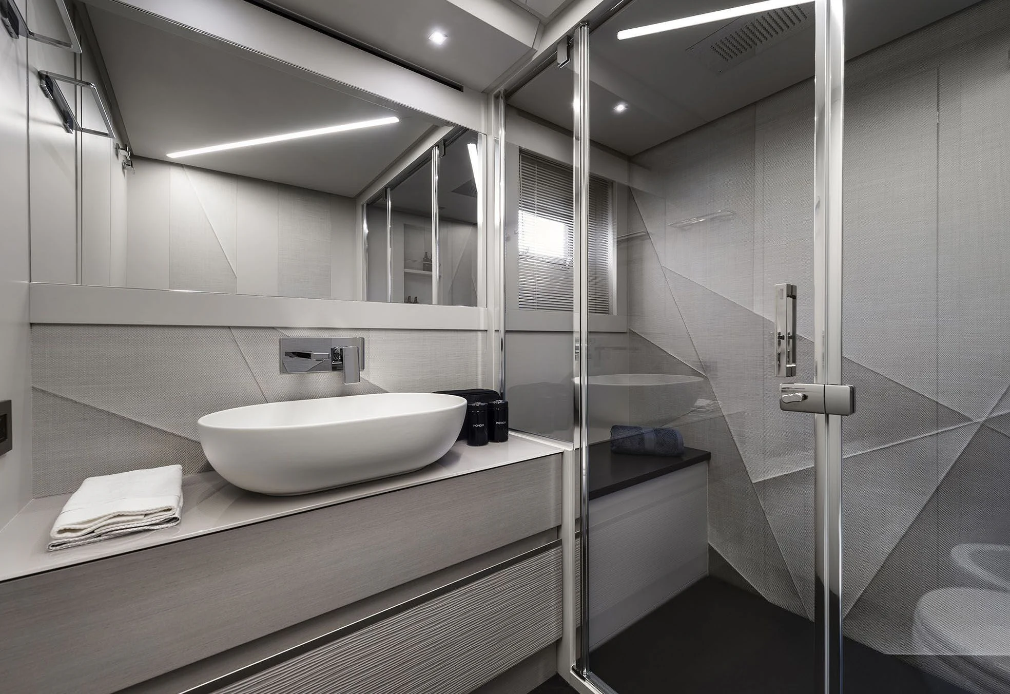 a bathroom with a sink and a mirror aboard UNREEL Yacht for Sale