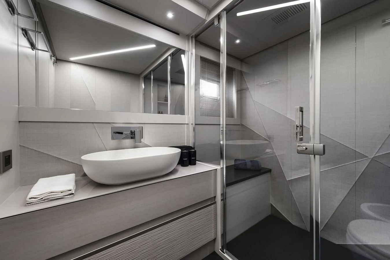 a bathroom with a sink and a mirror aboard UNREEL Yacht for Sale