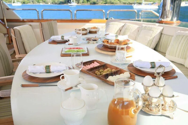 a table with food and drinks on it aboard FORTY LOVE Yacht for Charter
