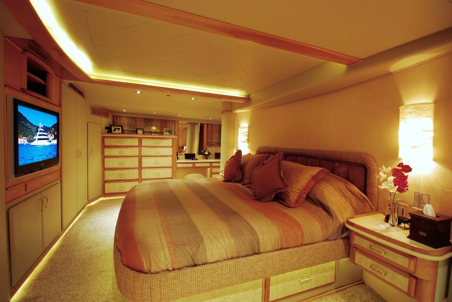 a bedroom with a bed and a tv aboard FORTY LOVE Yacht for Charter