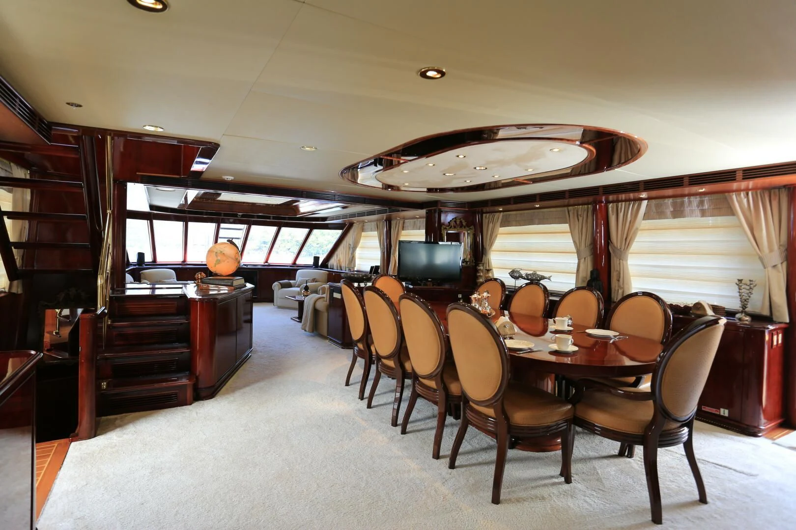 a large dining room with a large table and chairs aboard FORTY LOVE Yacht for Charter