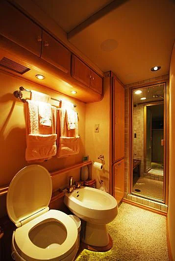 a bathroom with a toilet and sink aboard FORTY LOVE Yacht for Charter
