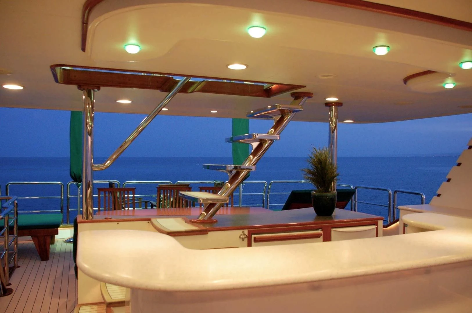 a pool with a table and chairs aboard FORTY LOVE Yacht for Charter