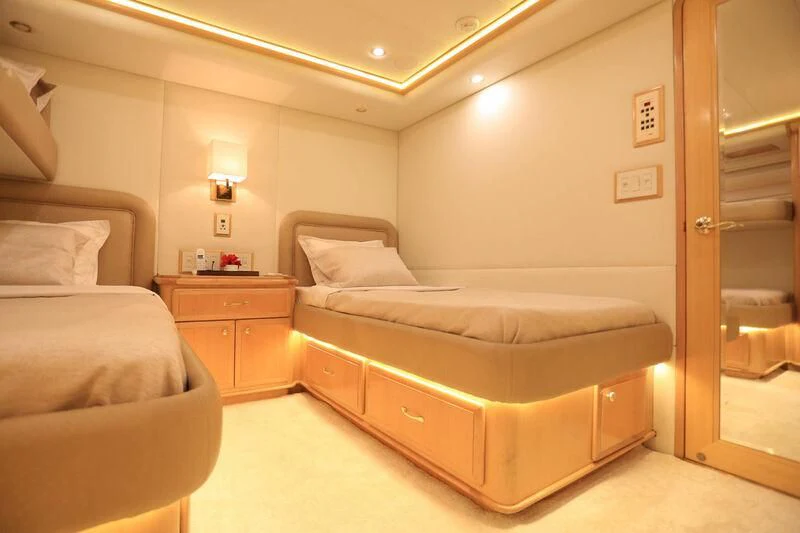 a bedroom with a bed and a desk aboard FORTY LOVE Yacht for Charter