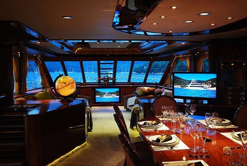 a person sleeping on a couch in a restaurant aboard FORTY LOVE Yacht for Charter