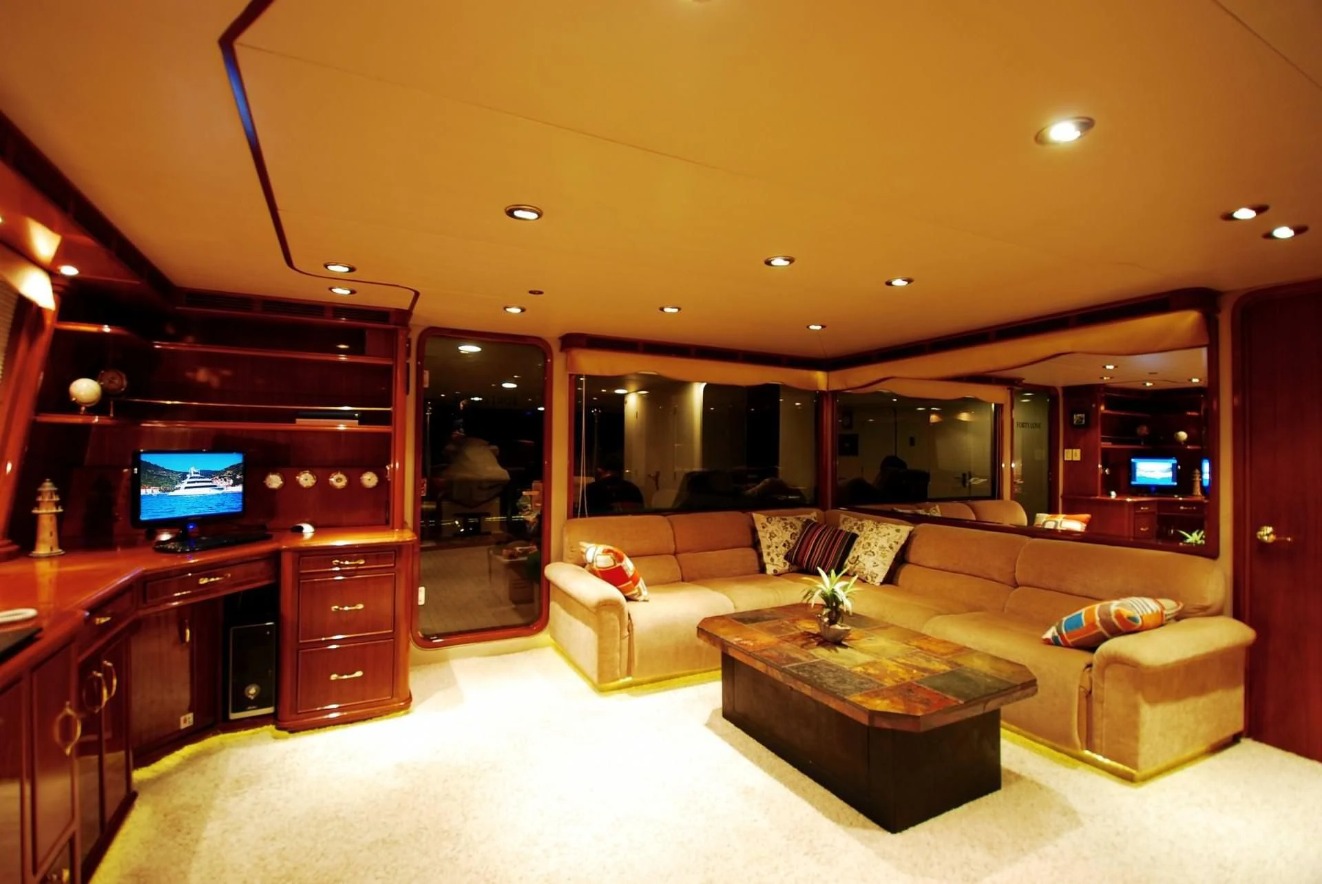 a living room with a couch and a tv aboard FORTY LOVE Yacht for Charter