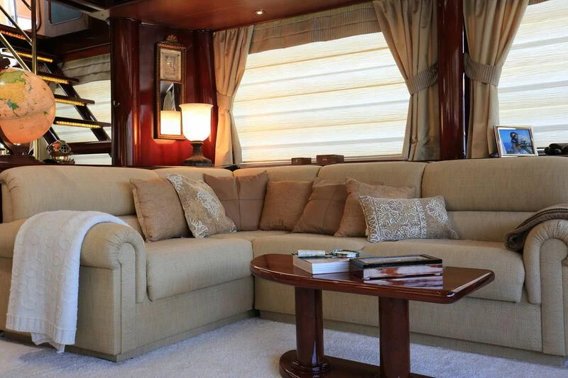 a living room with a couch and coffee table aboard FORTY LOVE Yacht for Charter
