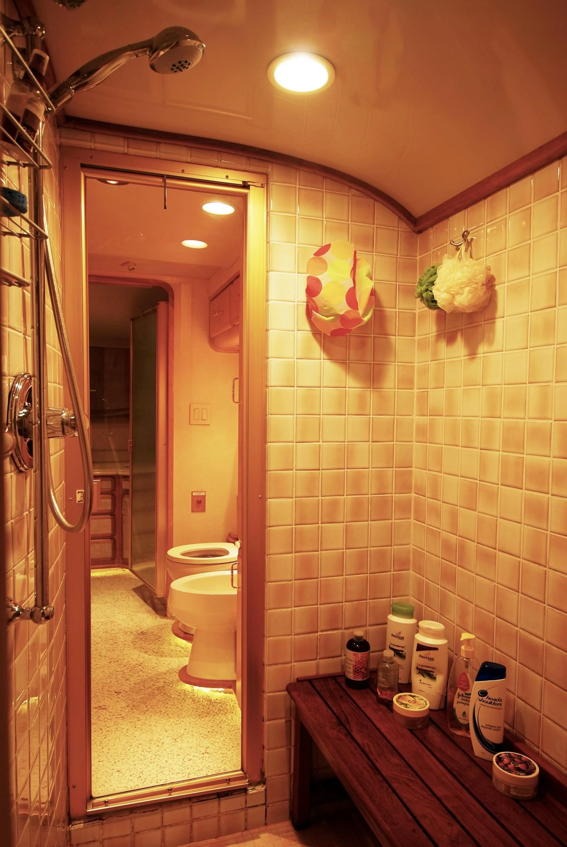 a bathroom with a toilet and a mirror aboard FORTY LOVE Yacht for Charter
