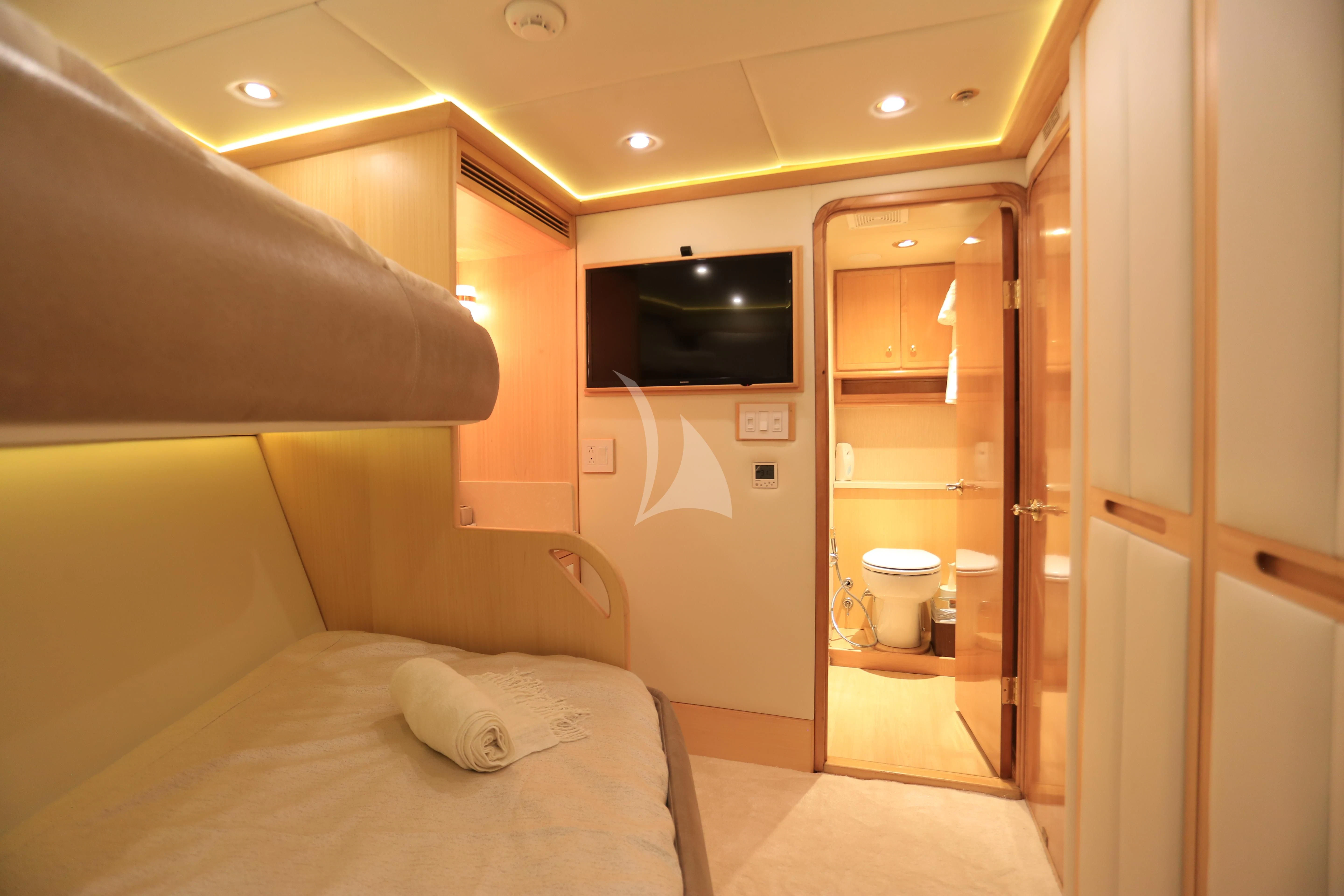 a bathroom with a bed and a television aboard FORTY LOVE Yacht for Charter