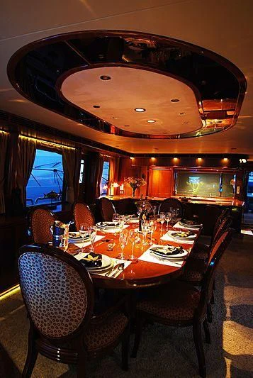 a dining room with a table and chairs aboard FORTY LOVE Yacht for Charter
