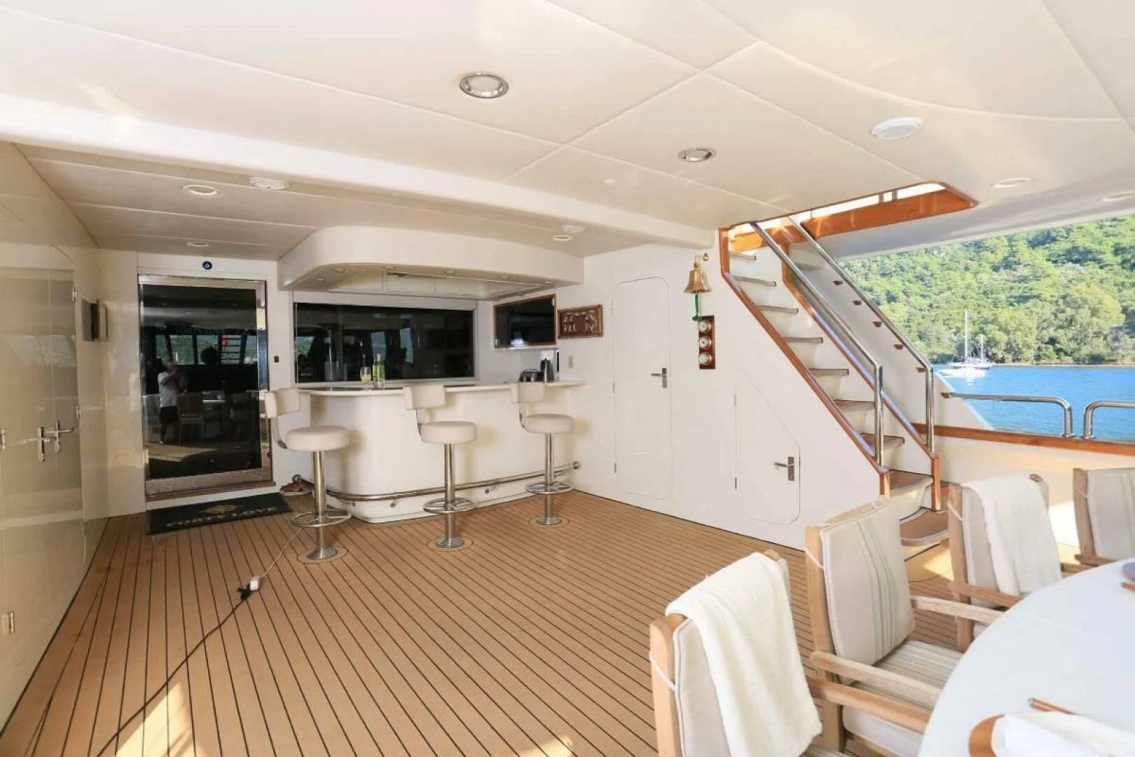 a room with a table chairs and a large window aboard FORTY LOVE Yacht for Charter