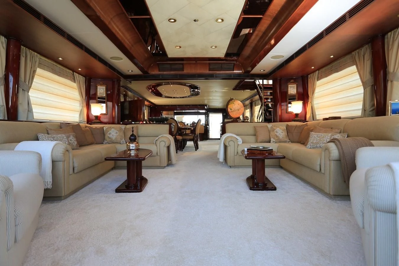 a large living room with a large white rug and a large white couch aboard FORTY LOVE Yacht for Charter