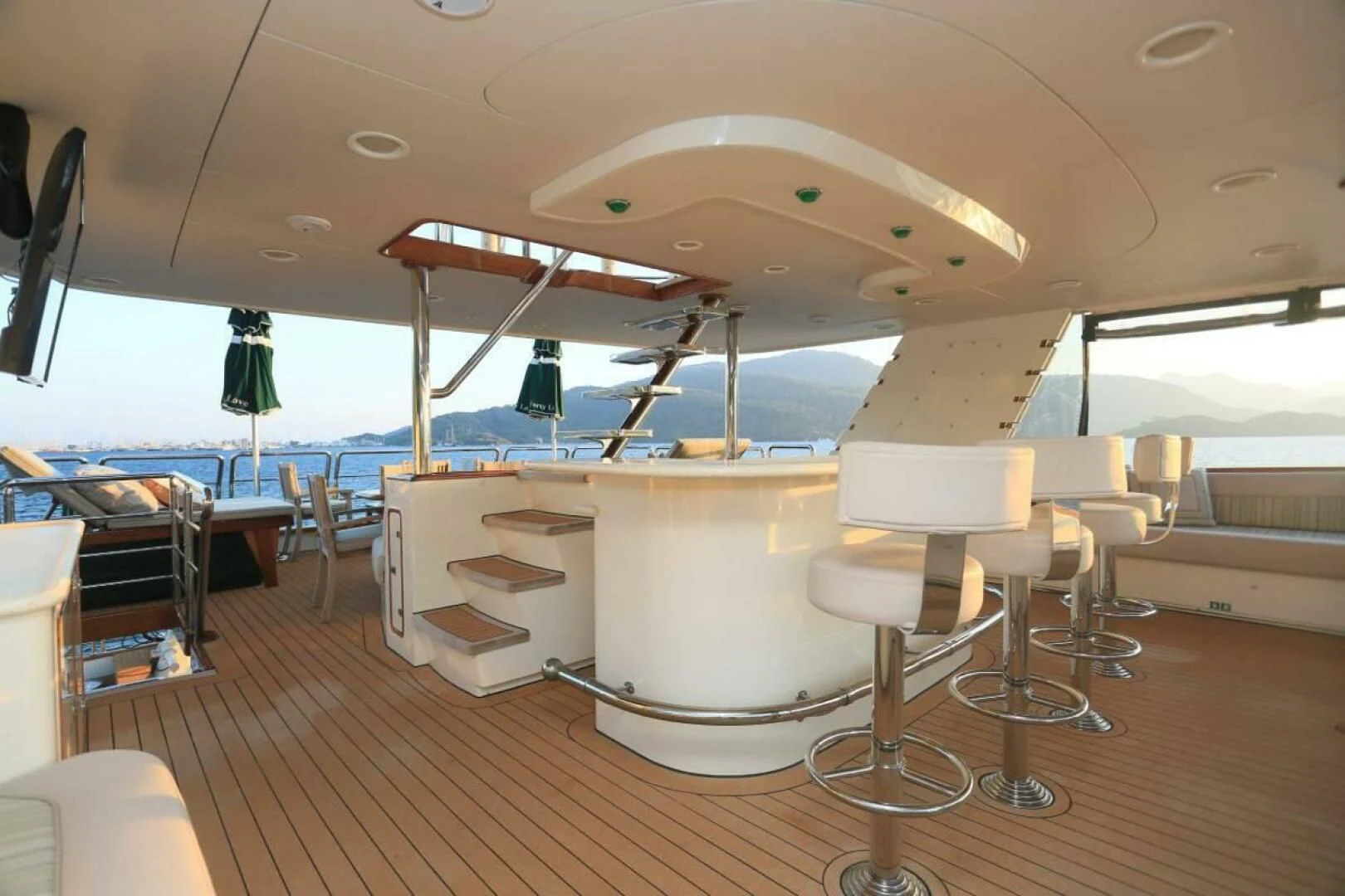 a room with tables and chairs aboard FORTY LOVE Yacht for Charter