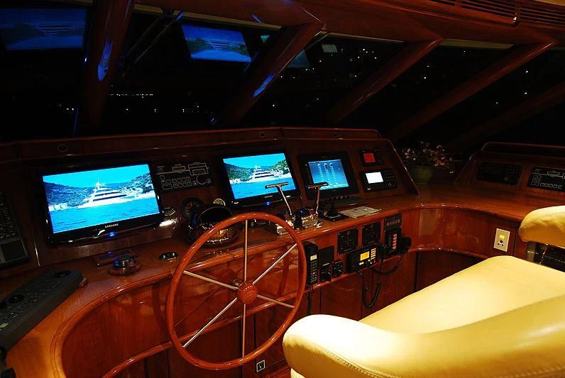 a control room with several monitors aboard FORTY LOVE Yacht for Charter