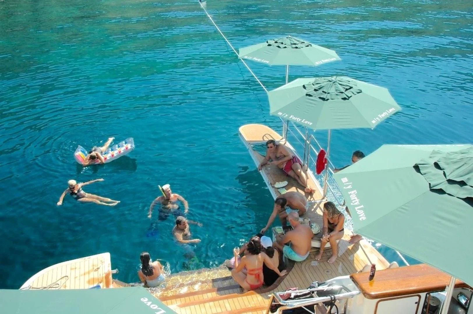 people on a beach aboard FORTY LOVE Yacht for Charter