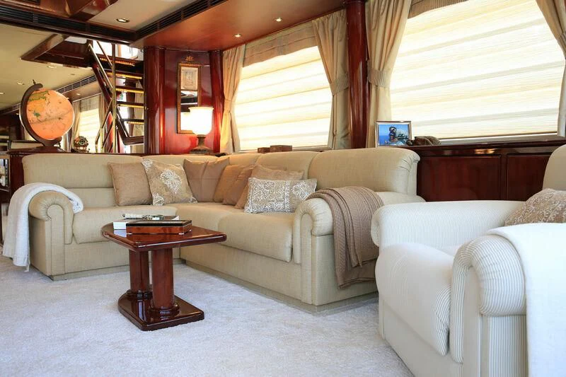 a living room with a couch and a table aboard FORTY LOVE Yacht for Charter