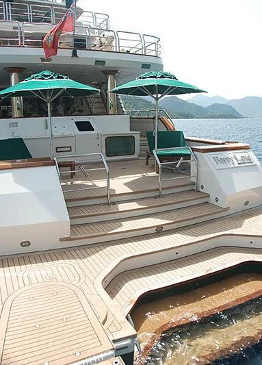 a boat with chairs and umbrellas aboard FORTY LOVE Yacht for Charter