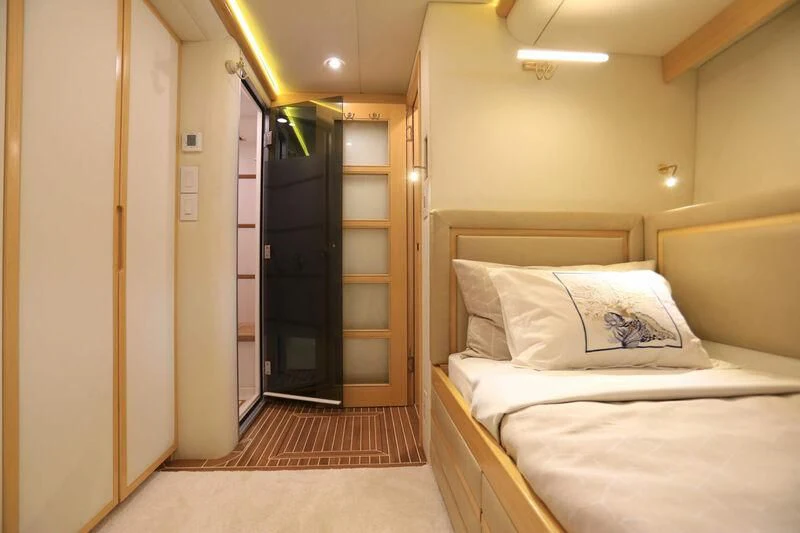 a bedroom with a bed and a closet aboard FORTY LOVE Yacht for Charter