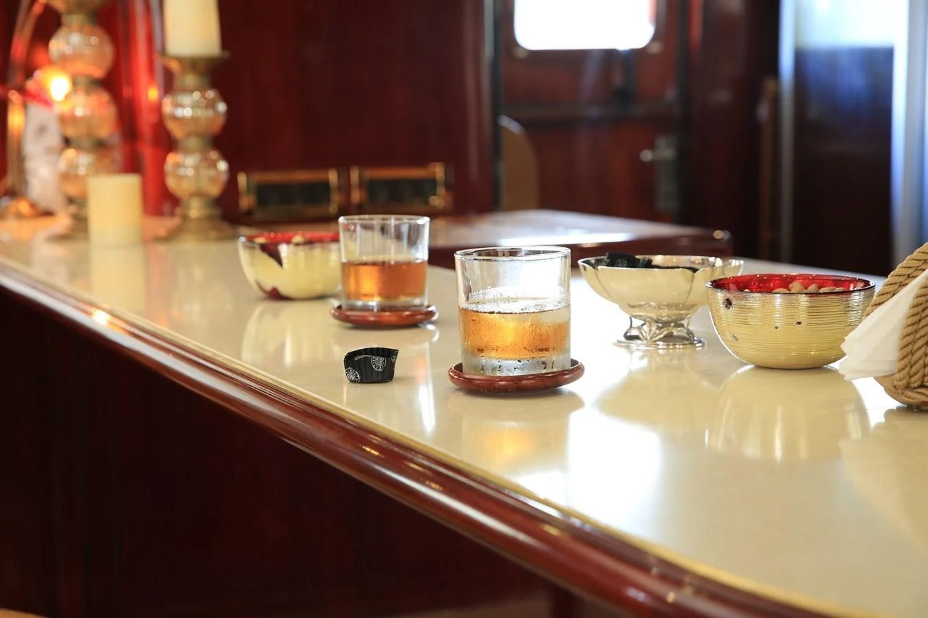 a table with glasses and plates aboard FORTY LOVE Yacht for Charter