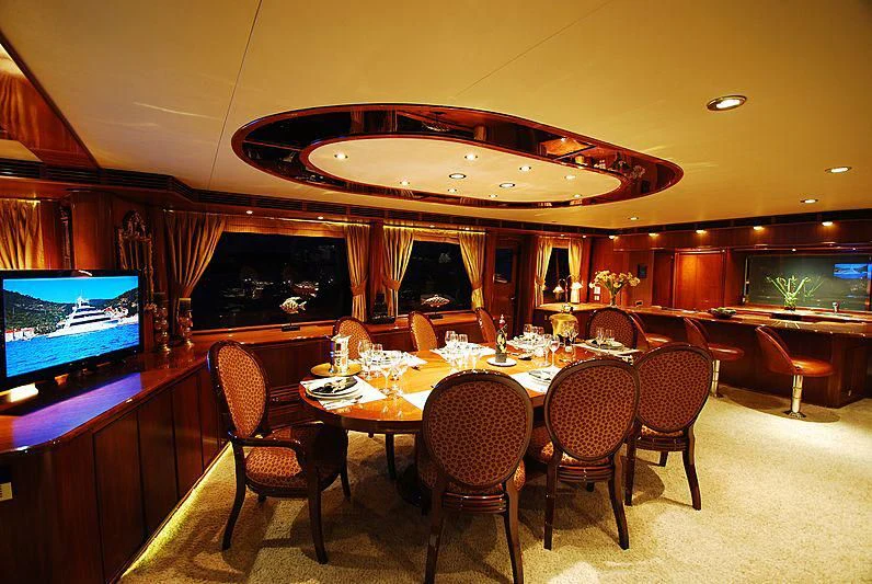 a room with a table and chairs aboard FORTY LOVE Yacht for Charter