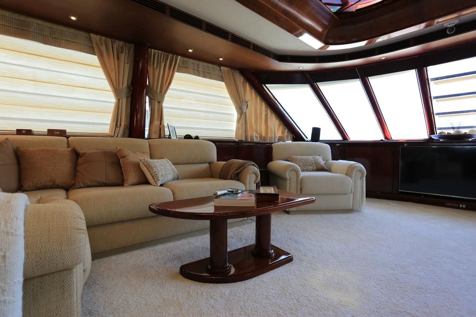 a living room with a couch and a coffee table aboard FORTY LOVE Yacht for Charter
