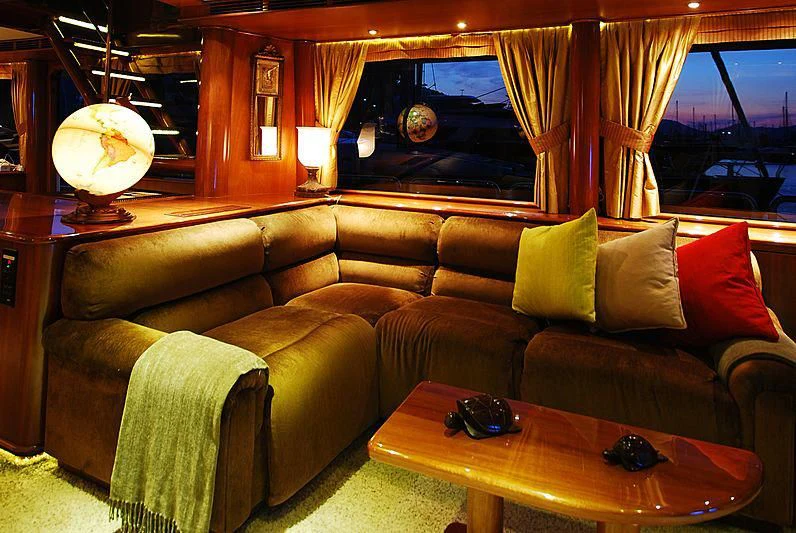 a living room with a couch and a table aboard FORTY LOVE Yacht for Charter