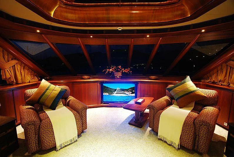 a room with couches and a television aboard FORTY LOVE Yacht for Charter