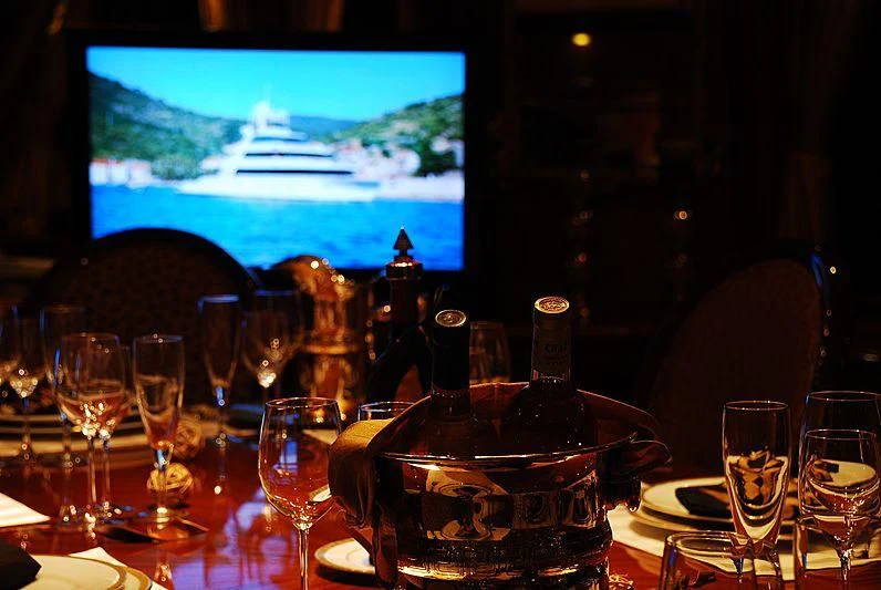 a table with wine glasses and bottles aboard FORTY LOVE Yacht for Charter
