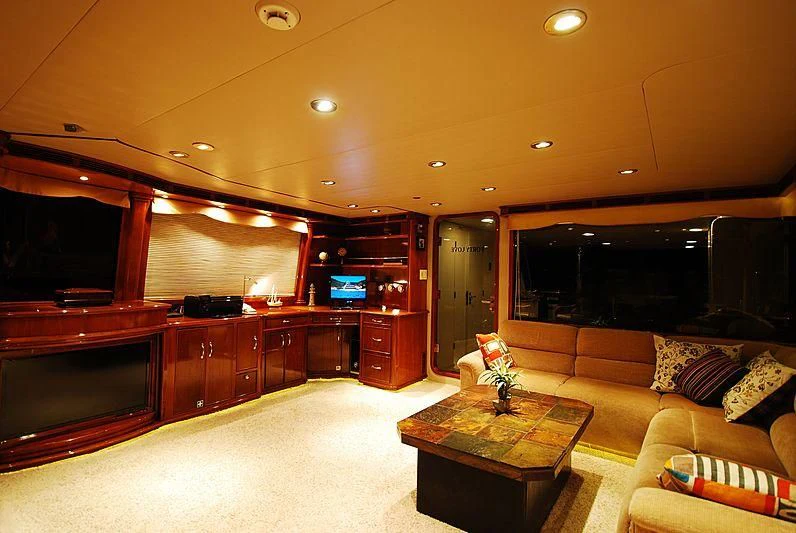 a living room with a couch and a tv aboard FORTY LOVE Yacht for Charter