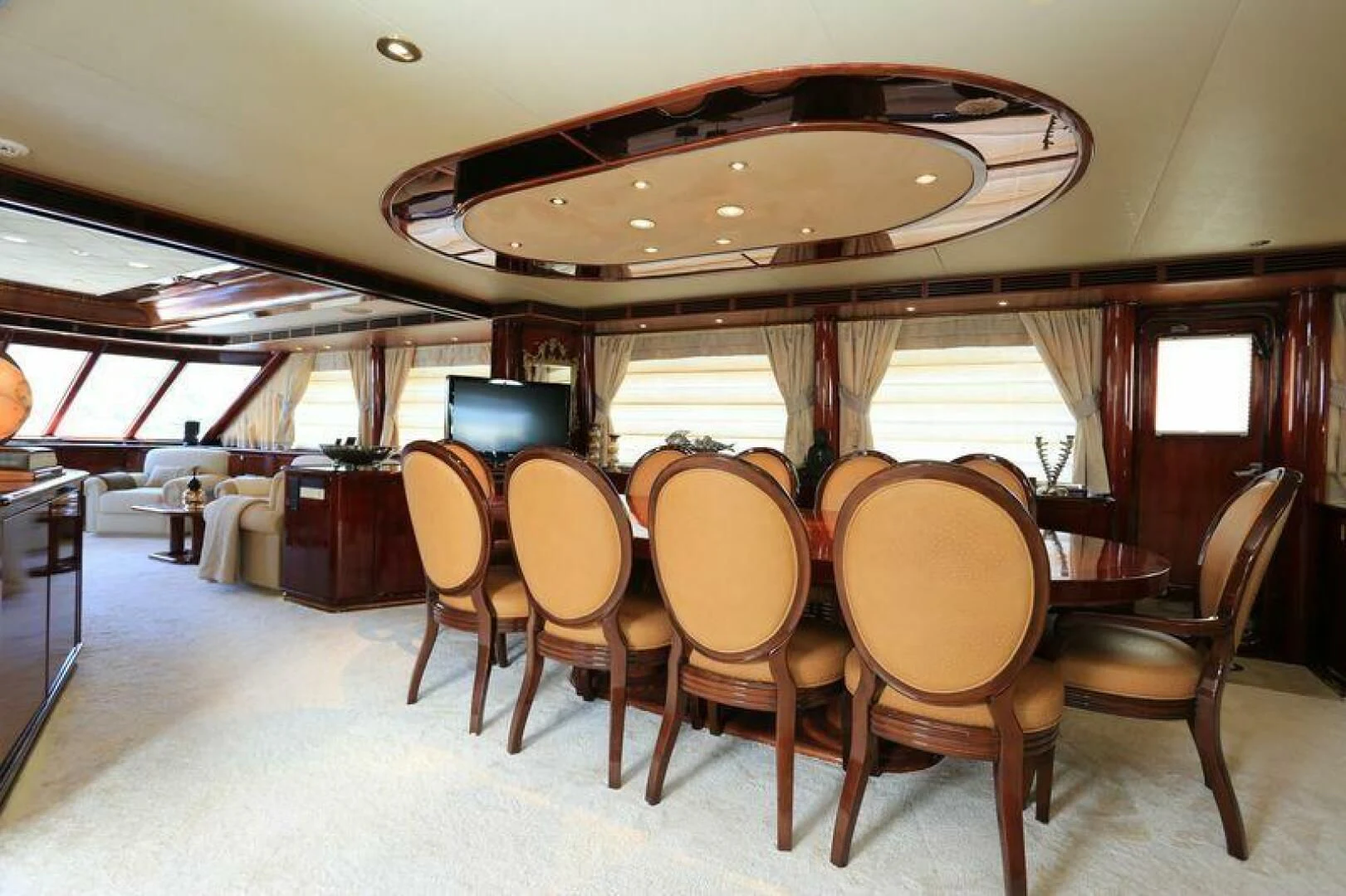 a large dining table with chairs aboard FORTY LOVE Yacht for Charter