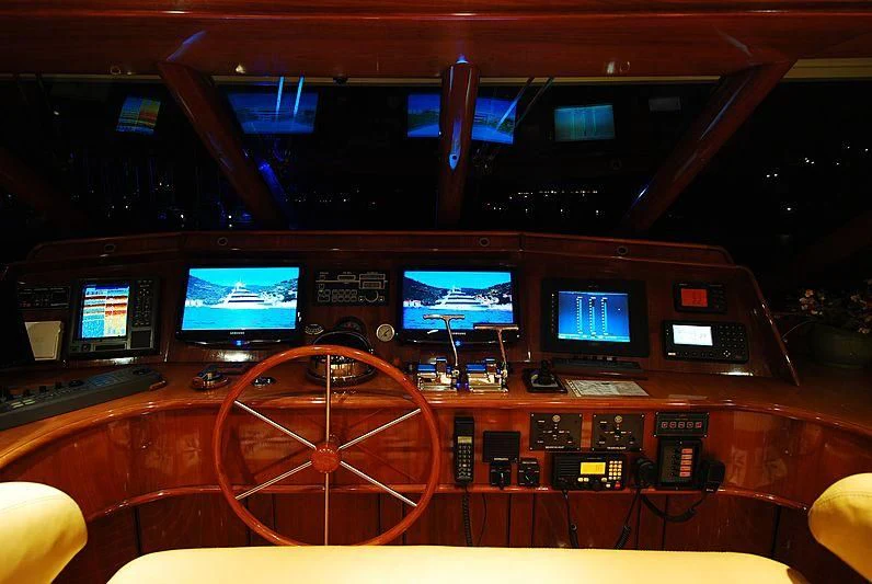 a control room with many monitors aboard FORTY LOVE Yacht for Charter