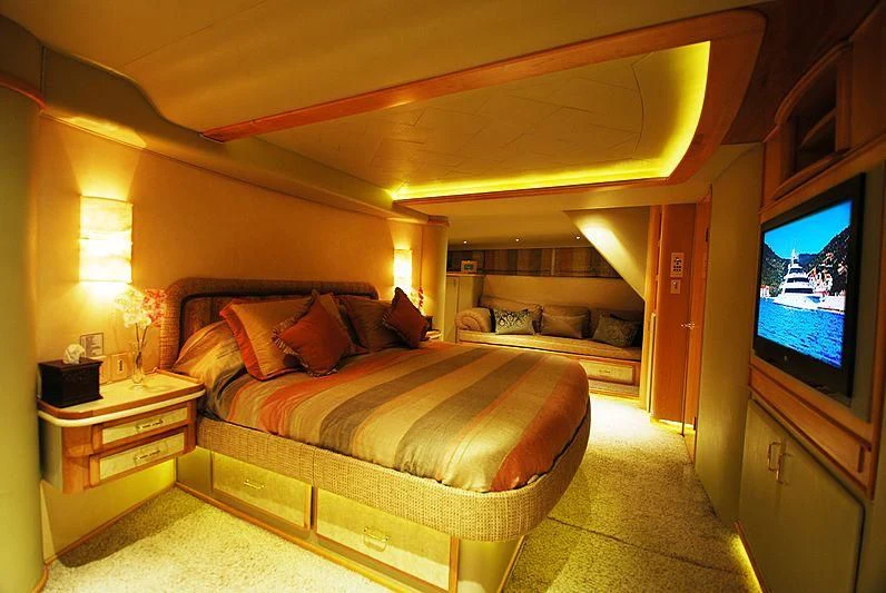 a bedroom with a bed and a tv aboard FORTY LOVE Yacht for Charter