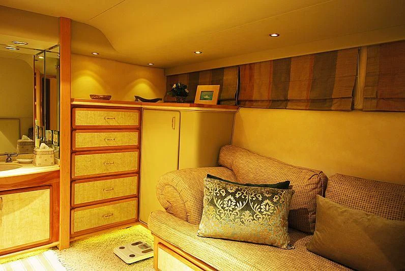 a living room with a couch and a mirror aboard FORTY LOVE Yacht for Charter