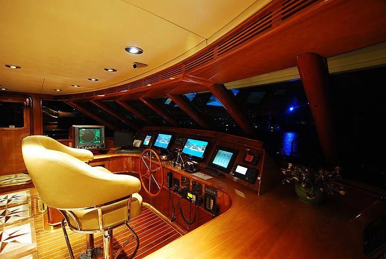 a room with many monitors and electronics aboard FORTY LOVE Yacht for Charter