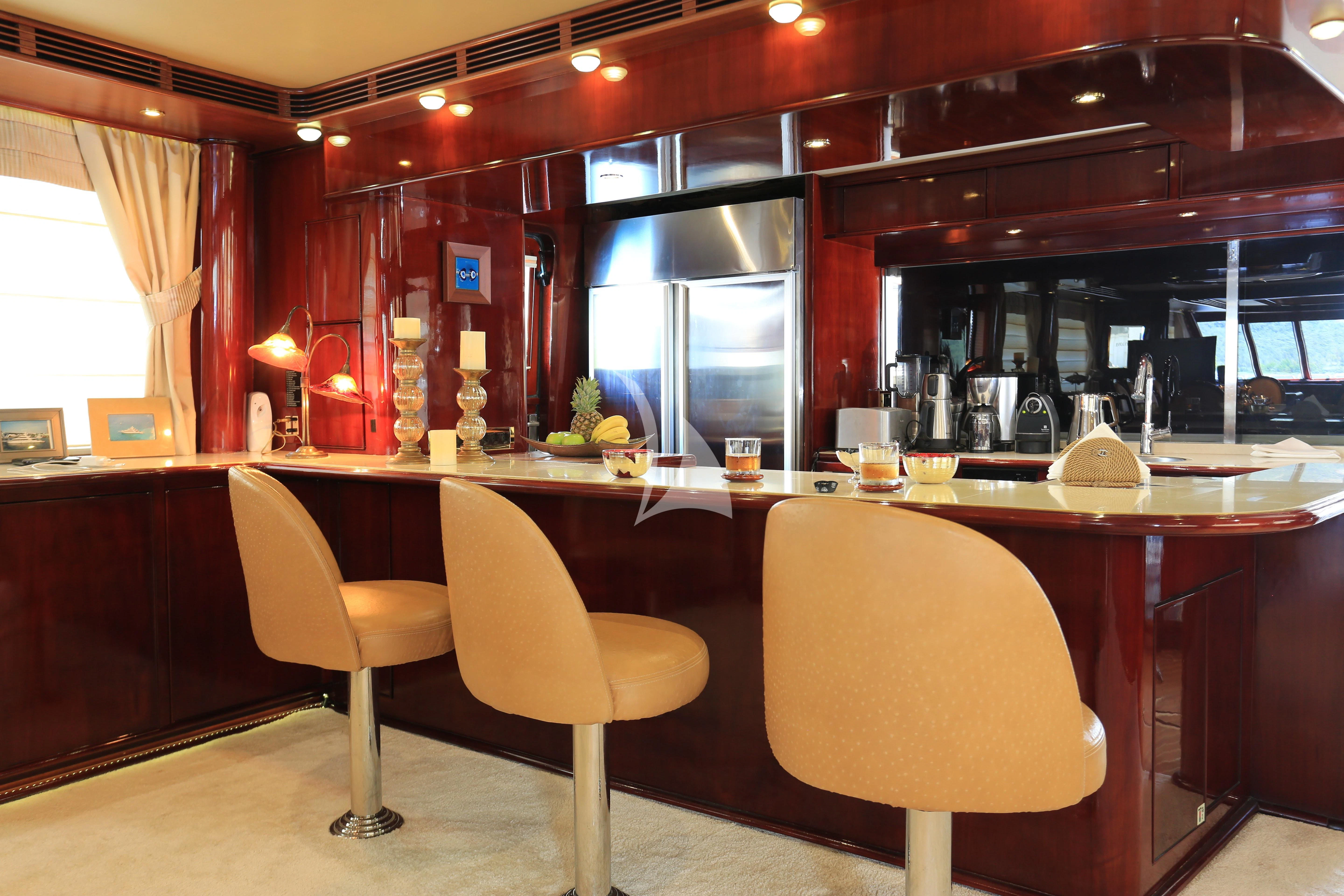 a restaurant with a bar and chairs aboard FORTY LOVE Yacht for Charter