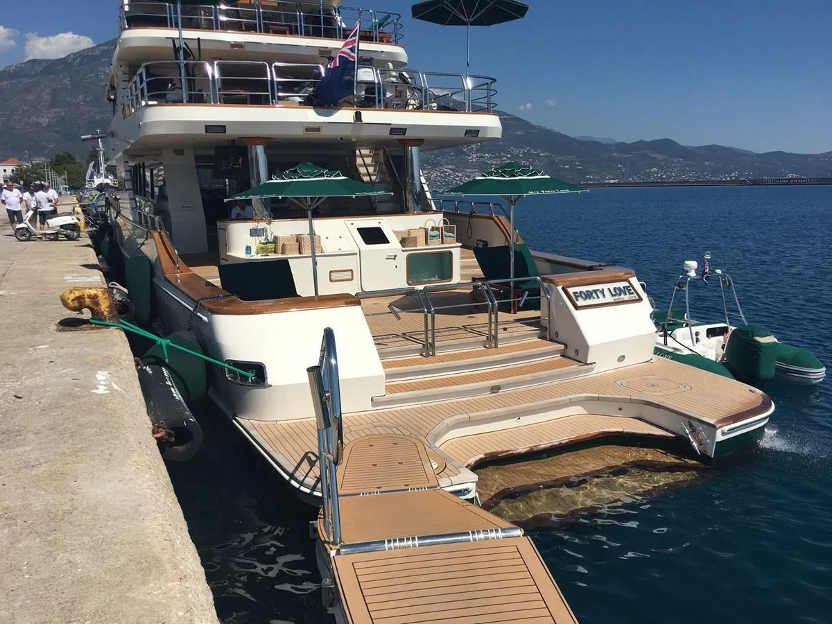 a boat docked at a pier aboard FORTY LOVE Yacht for Charter