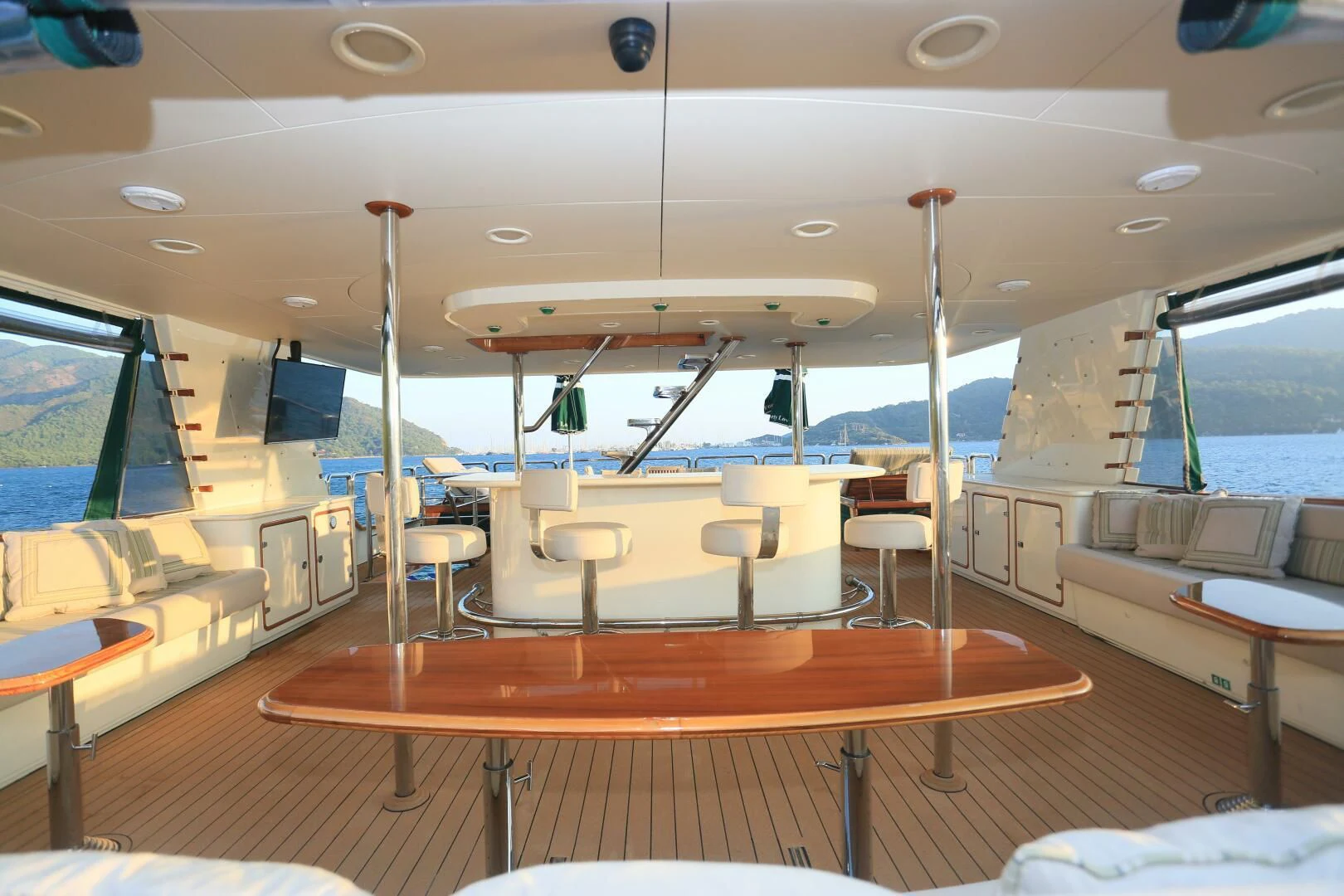 a room with tables and chairs aboard FORTY LOVE Yacht for Charter