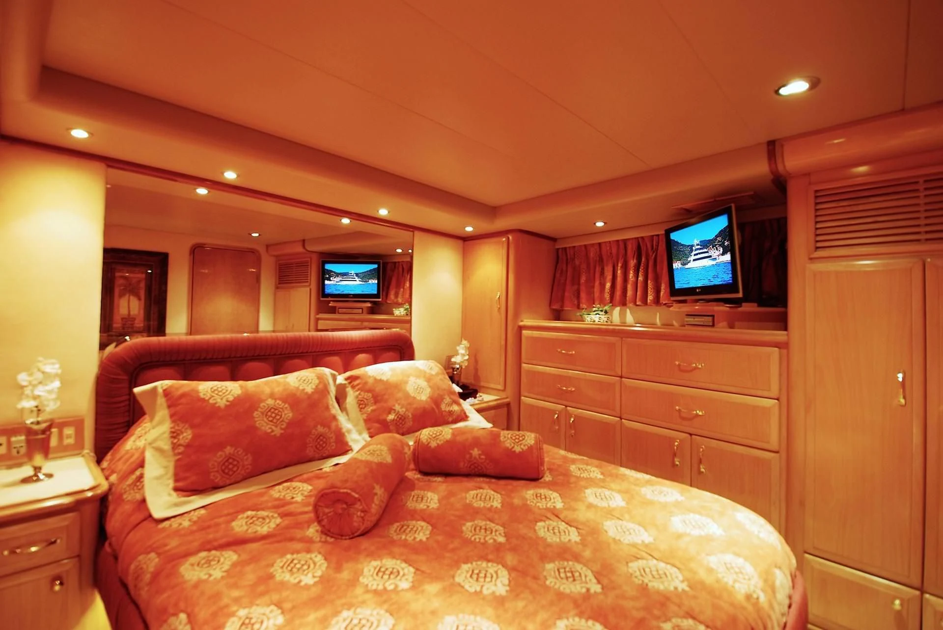 a bedroom with a bed and tv aboard FORTY LOVE Yacht for Charter