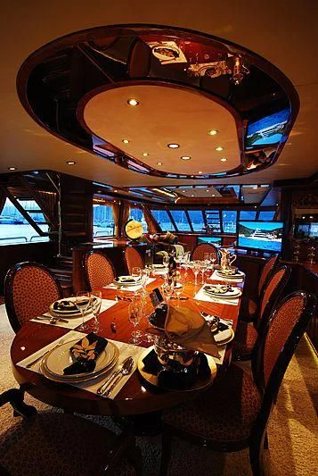 a restaurant with a table set for a meal aboard FORTY LOVE Yacht for Charter