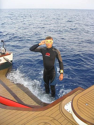 a person on a surfboard aboard FORTY LOVE Yacht for Charter