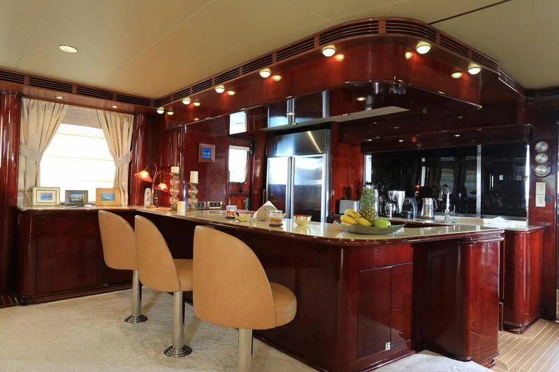 a kitchen with a bar and a table aboard FORTY LOVE Yacht for Charter