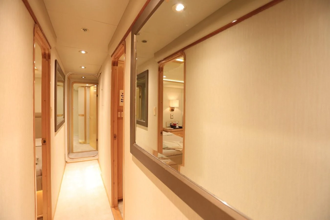 a hallway with a mirror and a bed aboard FORTY LOVE Yacht for Charter