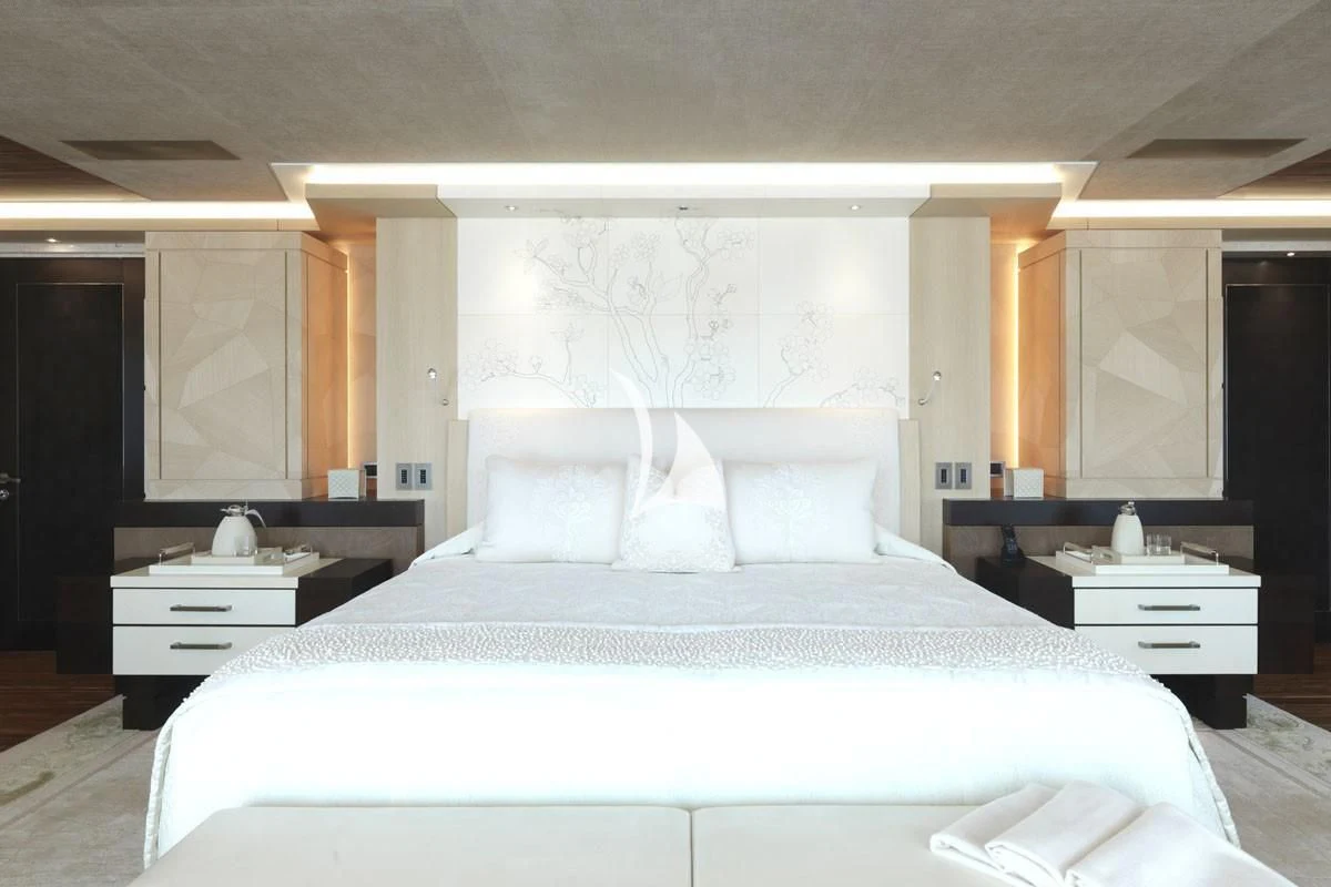 a large bed in a room aboard DRAAK Yacht for Sale