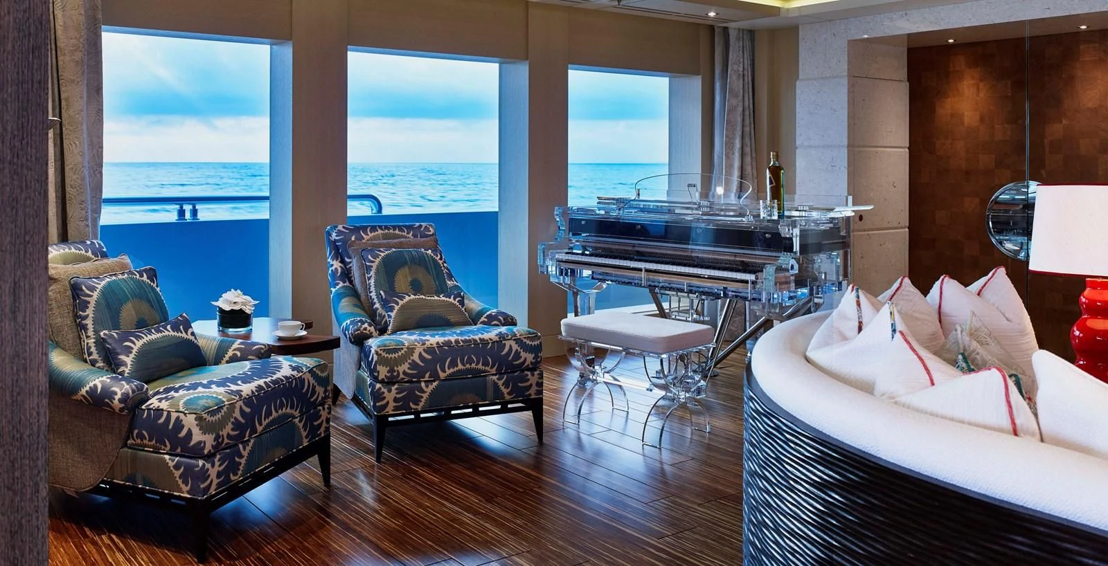 a room with a large window and a table with chairs and a large window aboard DRAAK Yacht for Sale