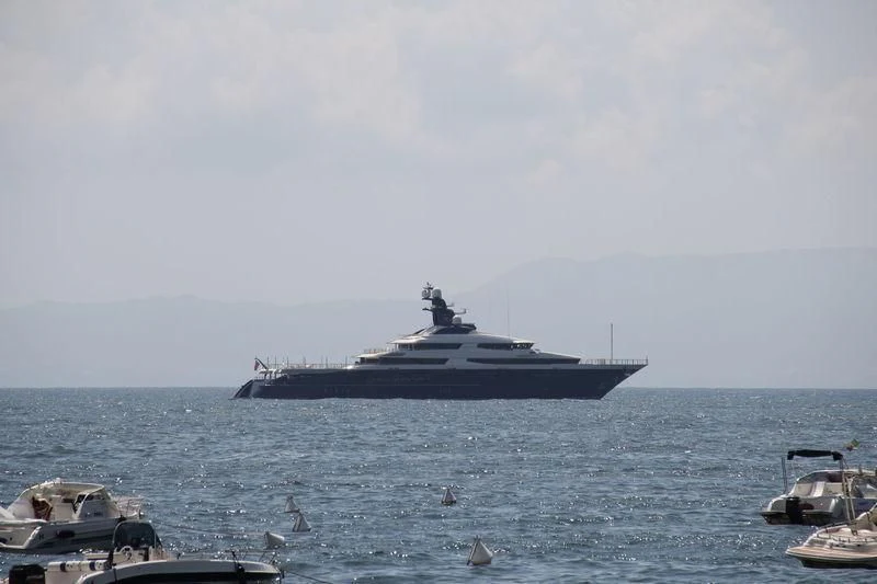 a large ship in the water aboard DRAAK Yacht for Sale