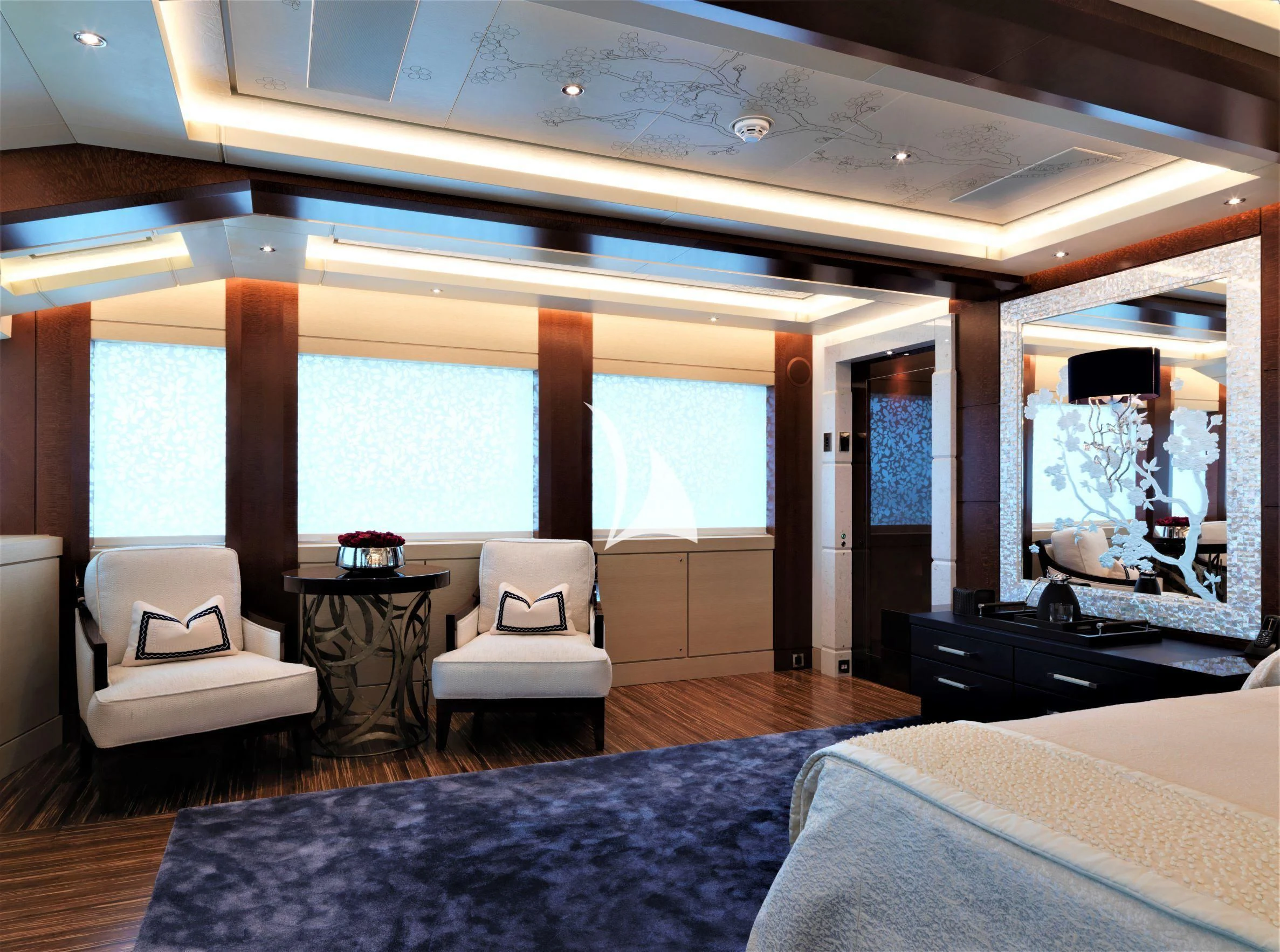 a room with a bed and a table aboard DRAAK Yacht for Sale