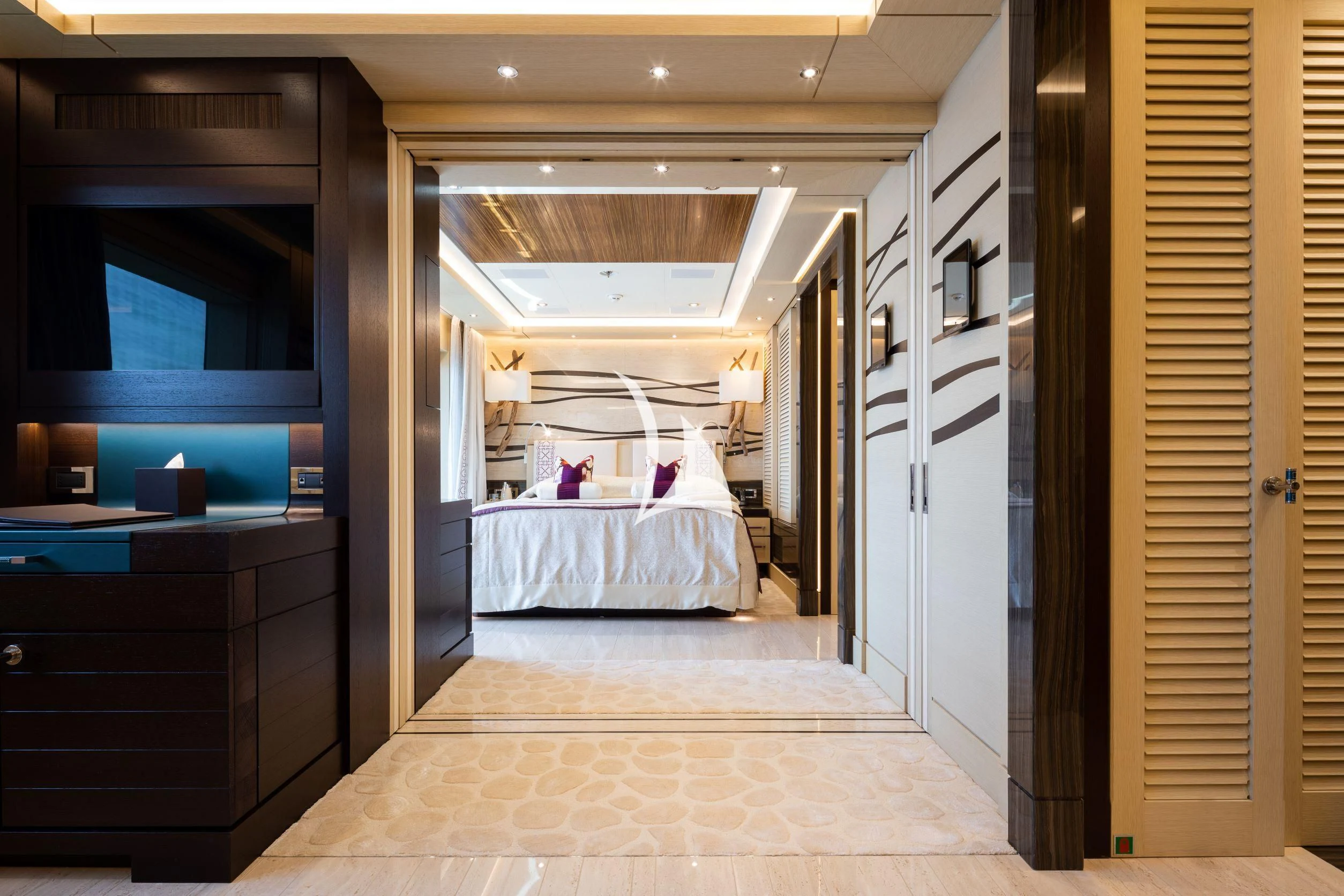 a bedroom with a bed aboard DRAAK Yacht for Sale