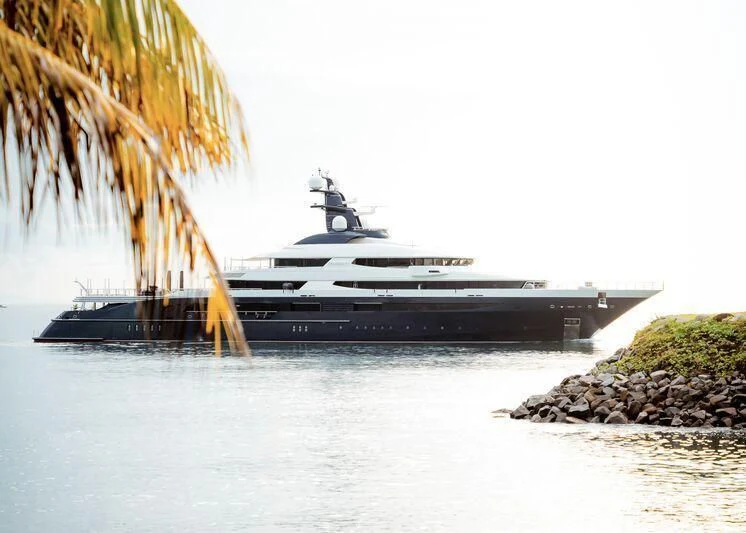 a large ship on a body of water aboard DRAAK Yacht for Sale