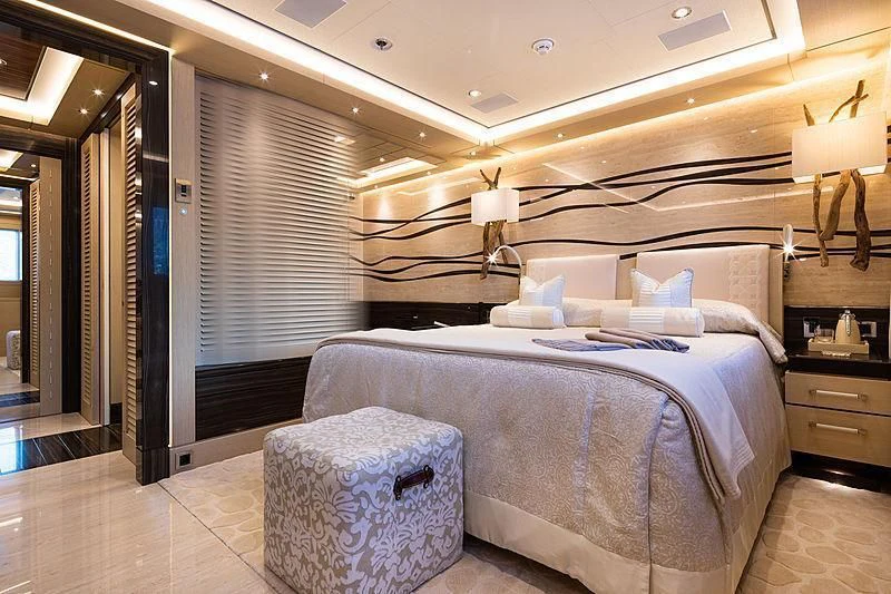 a bed in a room aboard DRAAK Yacht for Sale