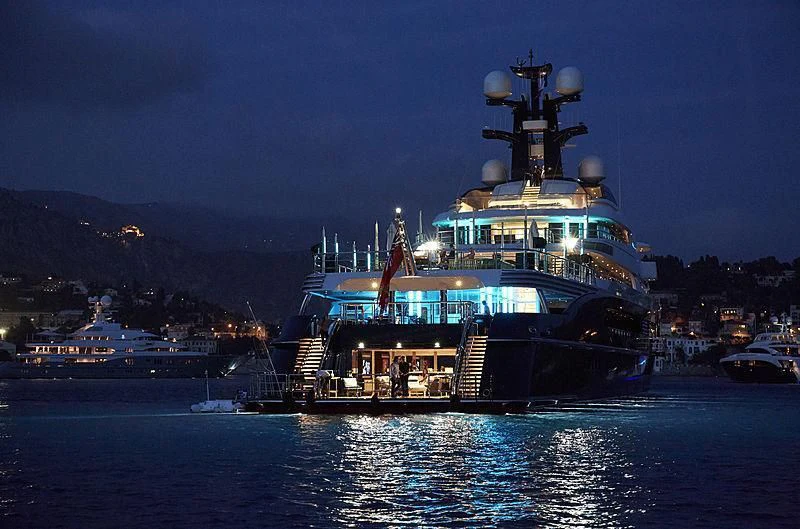 a large boat with lights on it aboard DRAAK Yacht for Sale